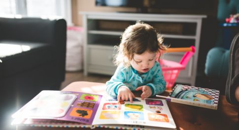 A small child reading a book